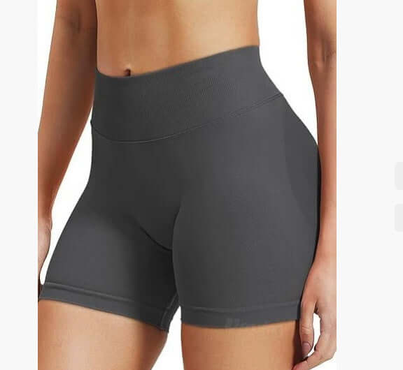 Dark gray athletic shorts worn by a person on a white background