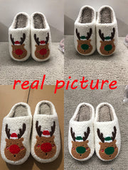 Pair of reindeer-themed slippers on a carpeted floor with 'real picture' text overlay.