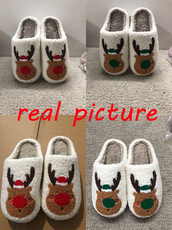 Pair of reindeer-themed slippers on a carpeted floor with 'real picture' text overlay.