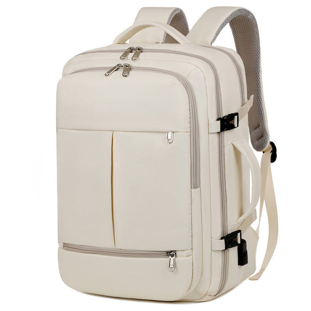 Beige backpack with multiple zippers on a white background