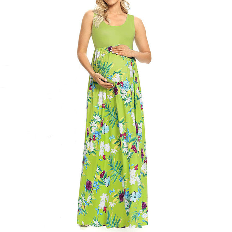 Woman wearing a green floral maxi dress on a white background