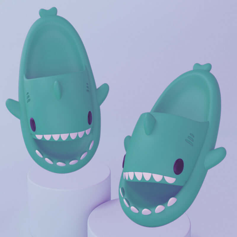 Cartoon shark slippers for adults in vibrant teal, designed for comfort and fun, perfect for indoor or outdoor use.