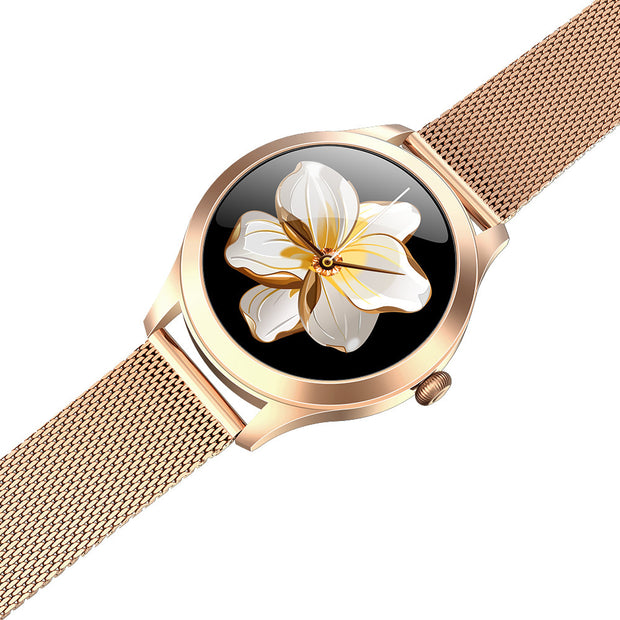 Rose gold watch with floral design on a white background