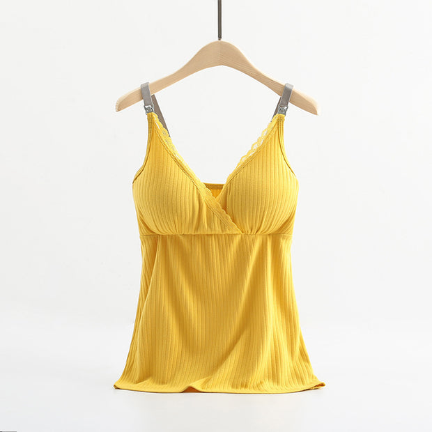Yellow pleated top on a hanger against a white background