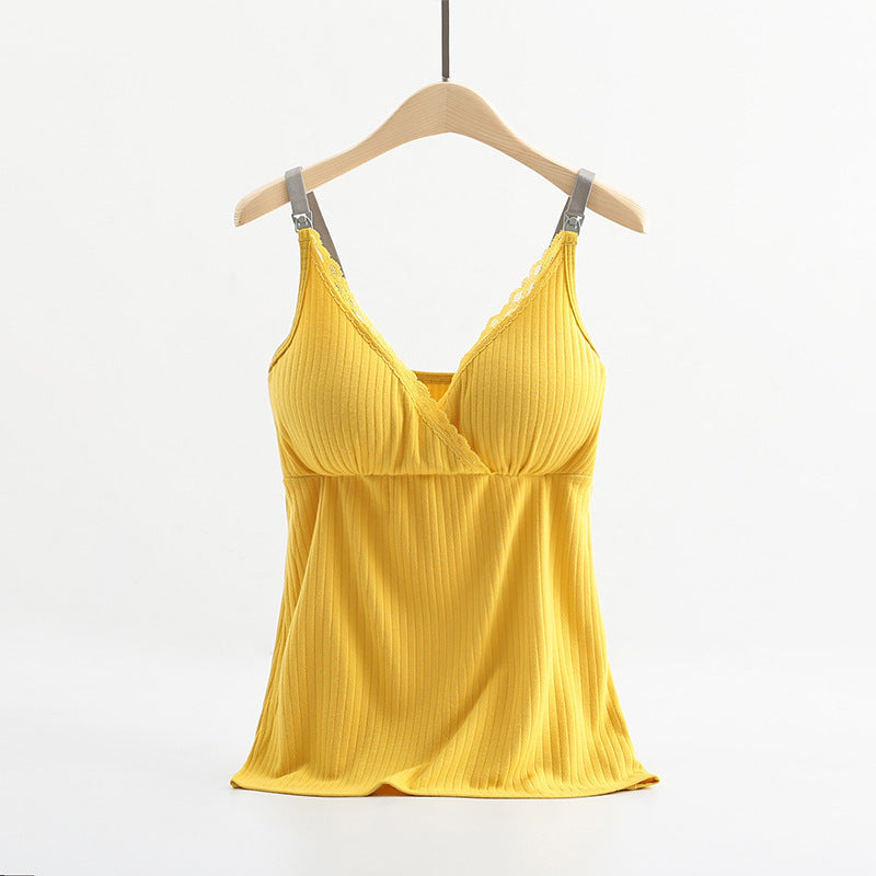 Yellow pleated top on a hanger against a white background
