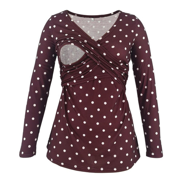 Maroon long-sleeve top with white polka dots on a white background