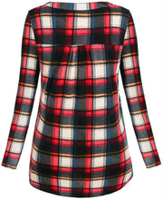 Plaid shirt with red, black, and white pattern on a white background
