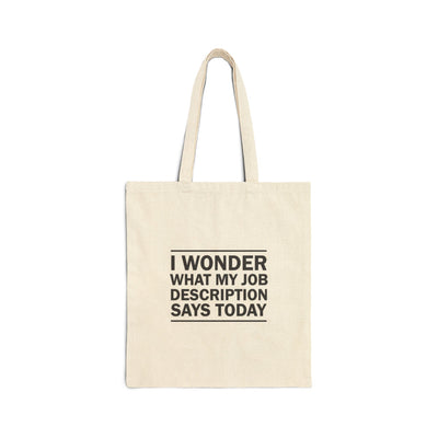 Beige tote bag with black text on a white background