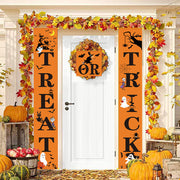 Halloween-themed door decorations with pumpkins and leaves.