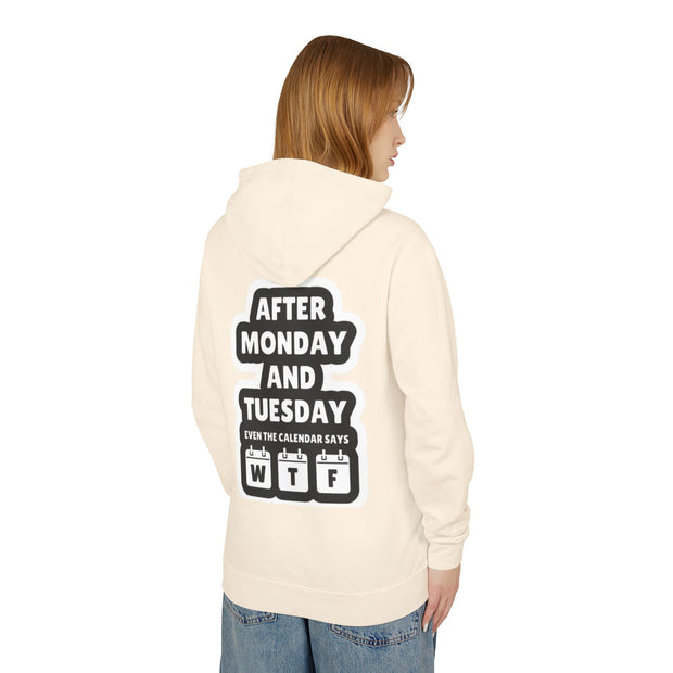 Person wearing a cream hoodie with text on the back, standing against a white background