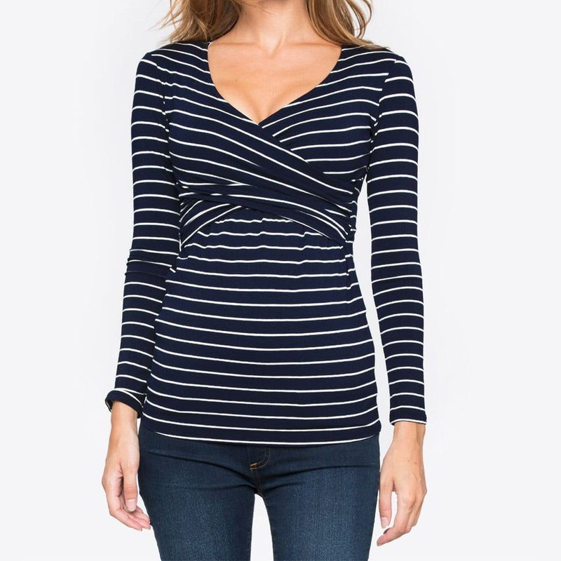 Navy and white striped long-sleeve top worn by a person on a white background