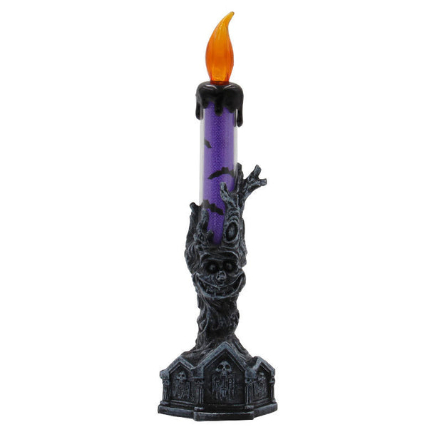 Decorative candle holder with a purple candle and orange flame on a white background
