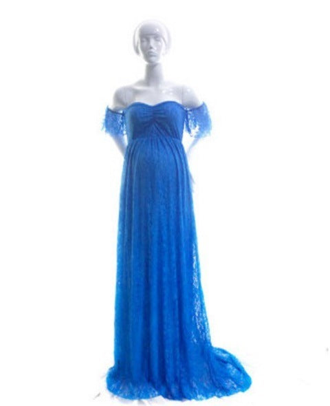 Blue evening gown on a mannequin against a white background