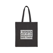 Black tote bag with white text on a white background