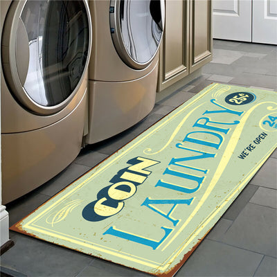Laundry mat with 'Coin Laundry' text in front of washing machines