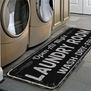 Laundry room mat with text in front of washing machines
