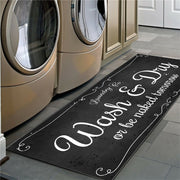 Laundry mat with humorous text in front of washing machines
