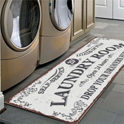 Laundry room rug with decorative text in front of washing machines
