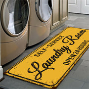 Laundry room mat with text in front of washing machines
