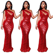 Red sequin dress worn by a model on a white background