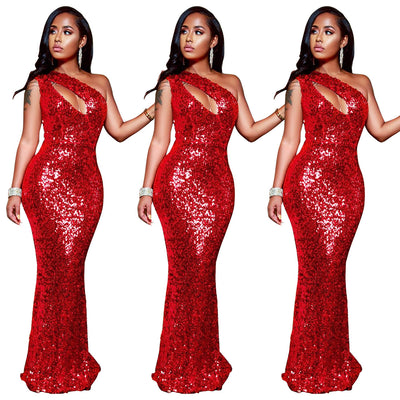 Red sequin dress worn by a model on a white background