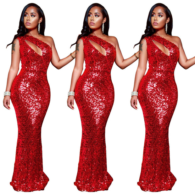 Red sequin dress worn by a model on a white background