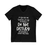 Black t-shirt with white text on a white background