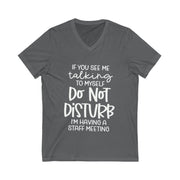 Gray t-shirt with white text on a white background