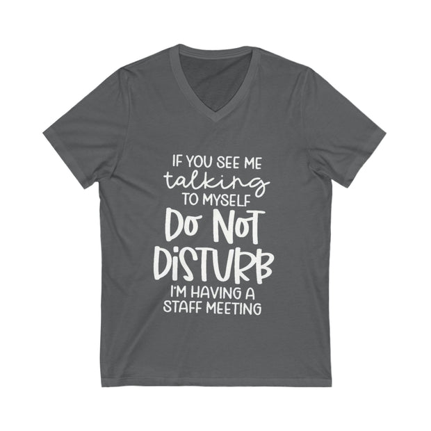 Gray t-shirt with white text on a white background