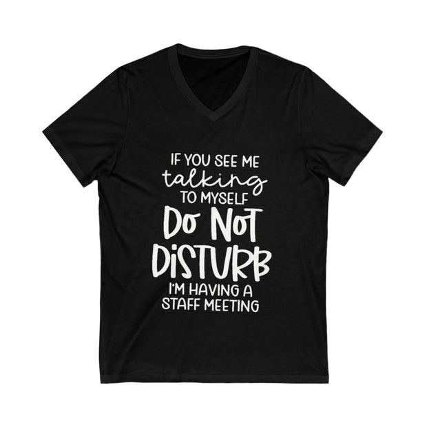 Black t-shirt with white text on a white background