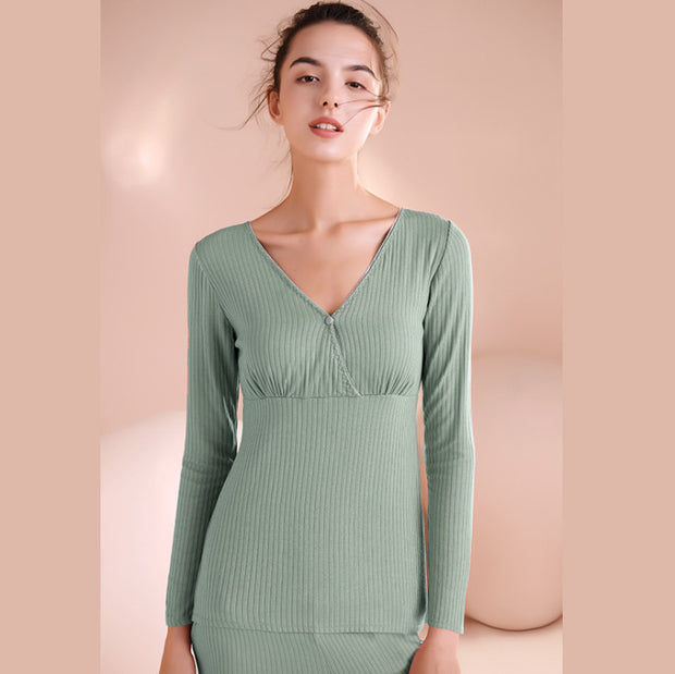 Woman wearing a green dress against a beige background