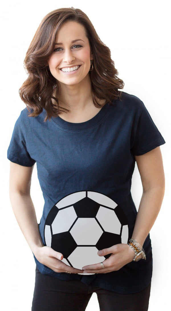 Woman wearing a blue t-shirt with a soccer ball design on a white background