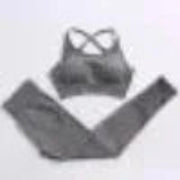 Gray sports bra and leggings set on a plain background