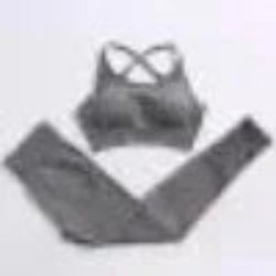 Gray sports bra and leggings set on a plain background