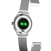 Silver smartwatch with green display on a white background