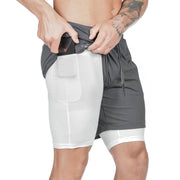 Person wearing gray and white athletic shorts on a white background