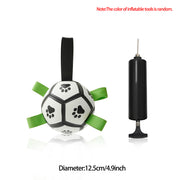 Dog toy resembling a soccer ball with green ribbons and a pump on a white background