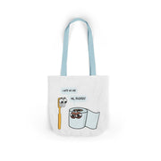 White tote bag with cartoon toothbrush and toilet paper design on a white background