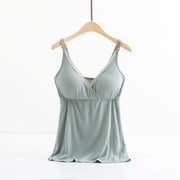 Light blue satin camisole on a wooden hanger against a white background