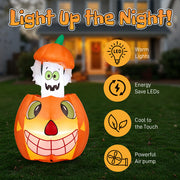 Halloween inflatable pumpkin with ghost face on grass, featuring LED lights and energy-saving features.