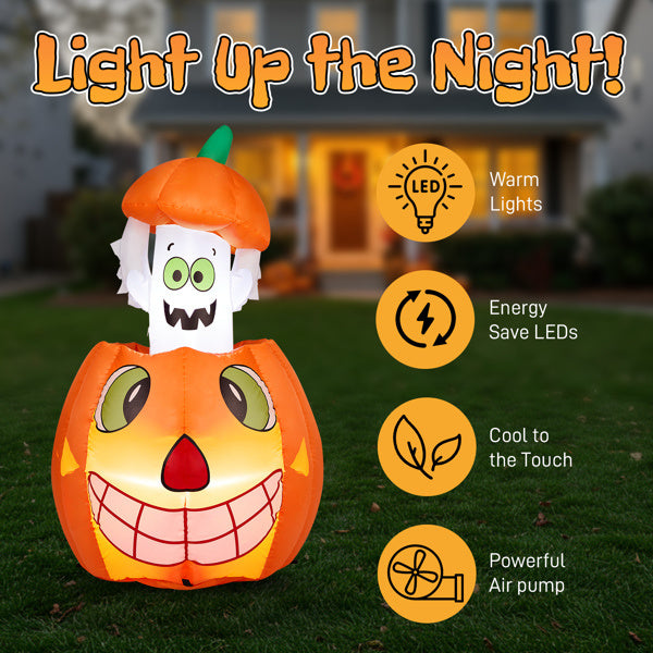 Halloween inflatable pumpkin with ghost face on grass, featuring LED lights and energy-saving features.