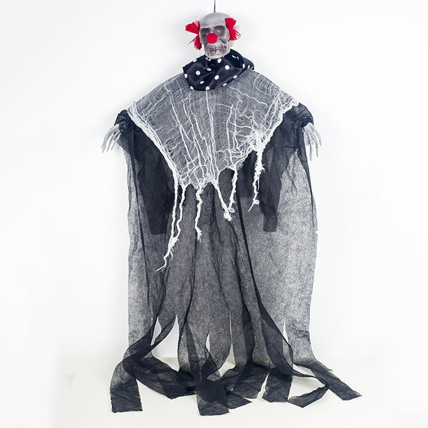Hanging clown decoration with a white sheet draped over it on a white background
