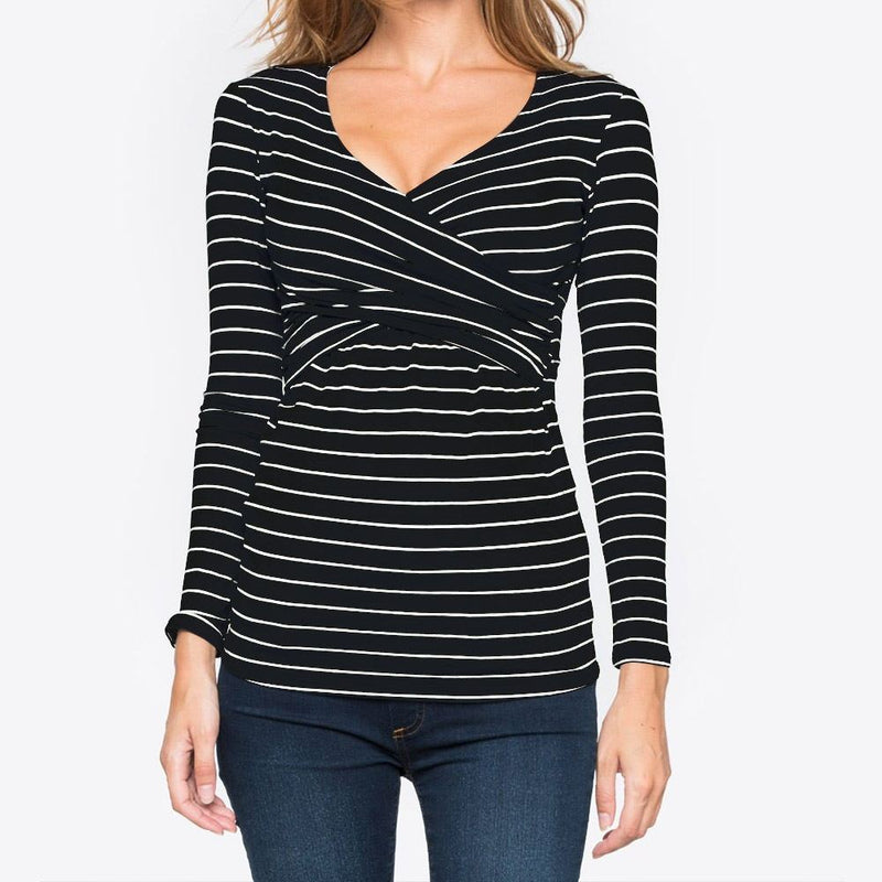 Black and white striped long-sleeve top worn by a person on a plain background