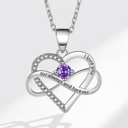 Silver heart-shaped necklace with a purple gemstone on a white background