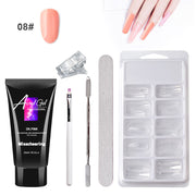 Nail art kit with acrylic gel, tools, and nail tips on a white background
