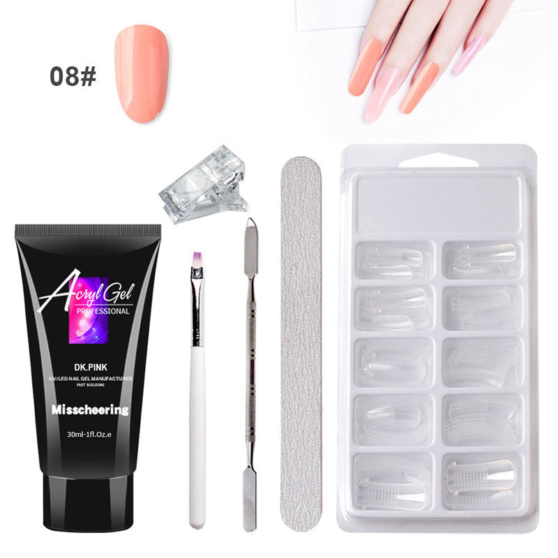 Nail art kit with acrylic gel, tools, and nail tips on a white background