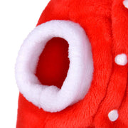 Close-up of a red plush toy with white interior and polka dots on a white background