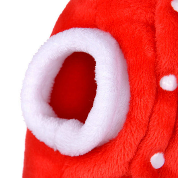 Close-up of a red plush toy with white interior and polka dots on a white background