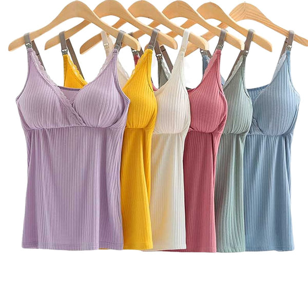 Set of colorful ribbed tank tops hanging on wooden hangers against a white background
