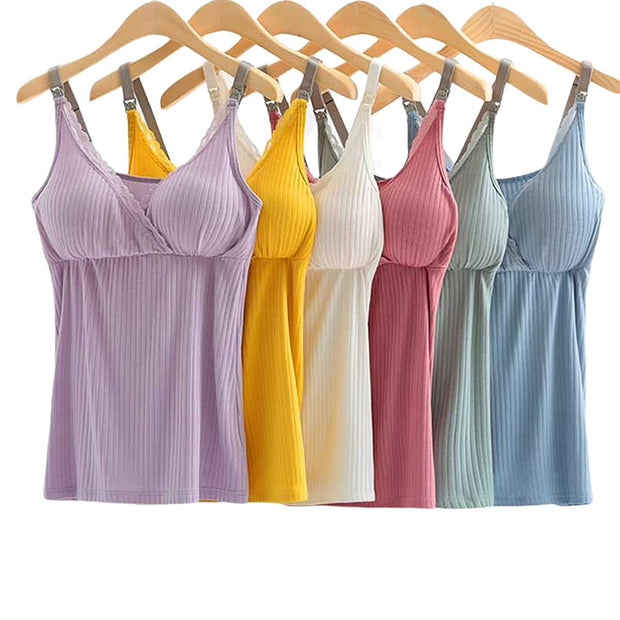 Set of colorful ribbed tank tops hanging on wooden hangers against a white background